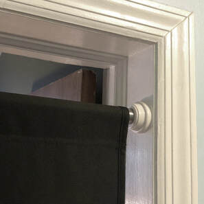 The PortaGlory glory hole easily adjusts to fit any doorway using heavy-duty tension rods.